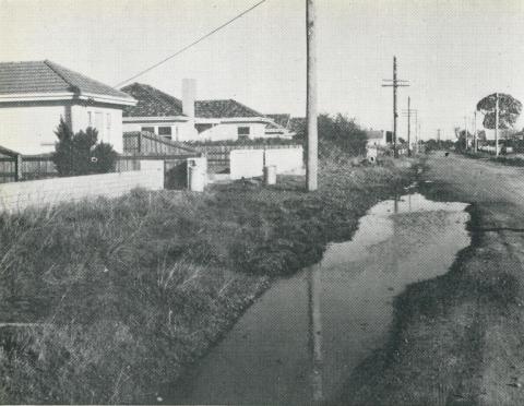 An unsewered area, where street channels are used to dispose of kitchen and laundry wastes, Melbourne, 1955