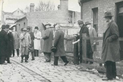 Premier of Victoria A. A. Dunstan visits Melbourne slum areas, 1942