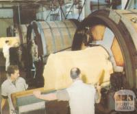 Taking butter from the churns at the Korumburra factory, c1952